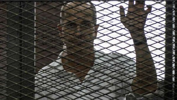 Egypt will retry Al Jazeera journalists Feb. 12 for charges of abetting terrorists and broadcasting false news. (AFP/File) 