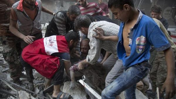 Victims are pulled from the rubble after a September airstrike in a rebel part of Aleppo (AFP/Karam al-Masri)