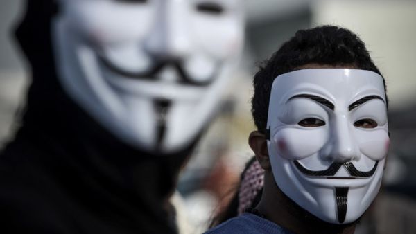 A member of anonymous donning a face mask. (AFP/Mohhamed Shaikh)