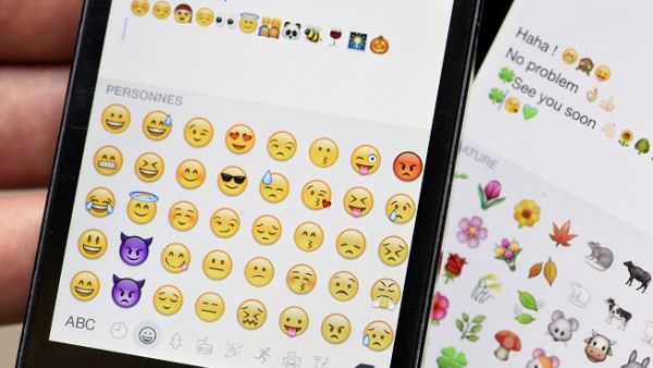 Apple reveals our most-used emoji, and it's the "tears of joy". (Miguel Medina/ AFP)
