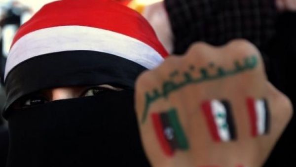 A young Yemeni woman's hand bears the flags of countries that took part in the Arab uprisings beginning in 2011.  (AFP/Marwan Naamani)