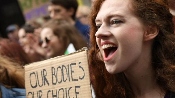 Protesters hold up placards during the March for Choice, calling for the legalisation of abortion in Ireland (AFP/File Photo)