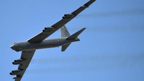 A B-52 Stratofortress flew alongside two jets near Osan, South Korea. (AFP/Raul Arborleda)