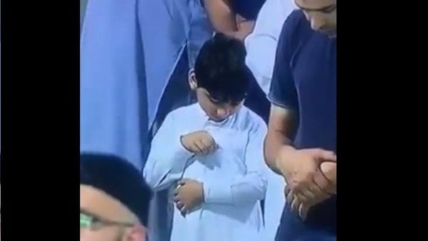 A viral video of a young boy seemingly checking on his pocket full of money is making the Internet coo in unison. (Screenshot/Facebook)