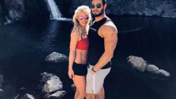 The 'Piece of Me' singer posted a picture of herself and the 23-year-old actor and fitness model enjoying a hike together to a romantic waterfall (Source: @britneyspears - Instagram)