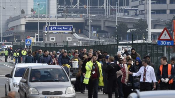 Passengers are evacuated from Brussels airport, on March 22, 2016 in Zaventem, after at least 13 people were killed and 35 injured as twin blasts rocked the main terminal of Brussels airport. (AFP/John Thys)