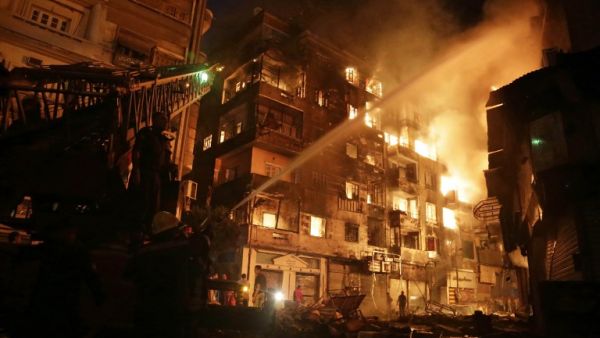 Firefighters fight a blaze in downtown Cairo on May, 9, 2016 - one of many fires in the city this week. (AFP/Ahmed Abd El-Gawad) Firefighters fight a blaze in downtown Cairo on May, 9, 2016 - one of many fires in the city this week. (AFP/Ahmed Abd El-Gawad)
