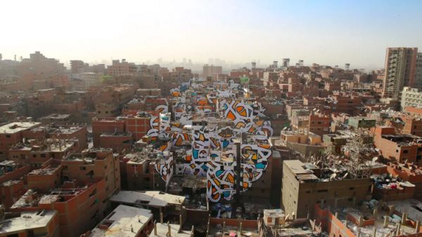 The French-Tunisian street artist eL Seed's latest work is a massive mural covering more than 40 buildings in Cairo's Garbage City. (Instagram) The French-Tunisian street artist eL Seed's latest work is a massive mural covering more than 40 buildings in Cairo's Garbage City. (Instagram)