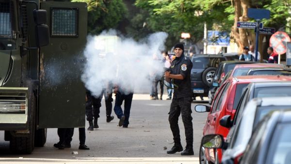 Egyptian riot police fire tear gas towards protestors as they demonstrate on April 25, 2016 in Cairo against the handing over of two Red Sea islands to Saudi Arabia. (AFP/Mohamed el-Shahed) Egyptian riot police fire tear gas towards protestors as they demonstrate on April 25, 2016 in Cairo against the handing over of two Red Sea islands to Saudi Arabia. (AFP/Mohamed el-Shahed)