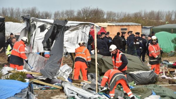 French police are seen demolishing part of "The Jungle" camp in Calais. (AFP/File)