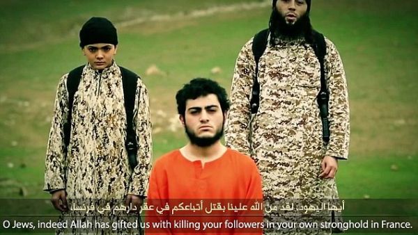In the Daesh video the child shoots an Arab-Israeli accused of spying for Israel (File-AFP) In the Daesh video the child shoots an Arab-Israeli accused of spying for Israel (File-AFP)