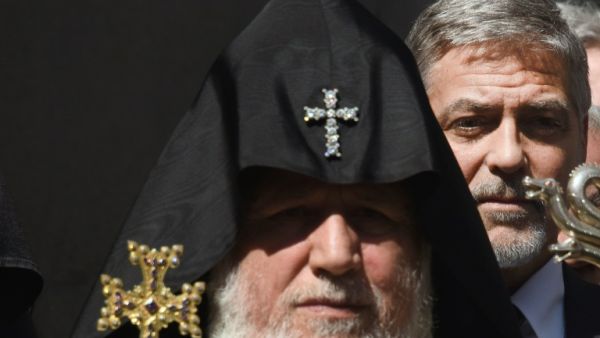 George Clooney next to a pope at the Genocide Memorial in Yerevan on April 24. (AFP / Karen Minasyan)