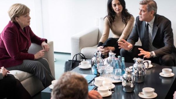 The Clooneys meet with Angela Merkel. (Guido Bergmann, BPA , EPA)