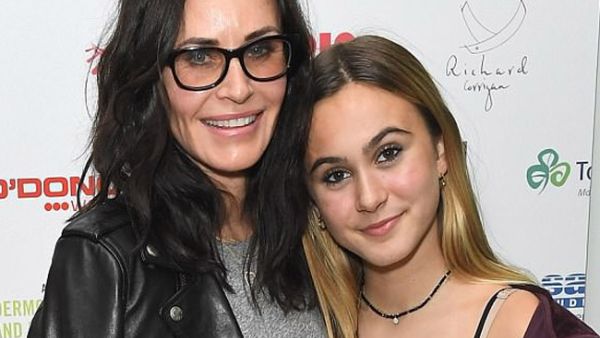 Courtney cut a stylish figure in a lightweight grey knit (Source: James Gourley / Shutterstock )