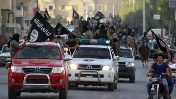 Daesh militants ride in Toyota Hilux pickups through the streets of the group's de facto Syrian capital of Raqqa. (Twitter)