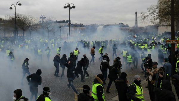 Police fired tear gas and water cannon to disperse advancing "yellow vest" protesters at the Arc de Triomphe in Paris. (AFP/ File)