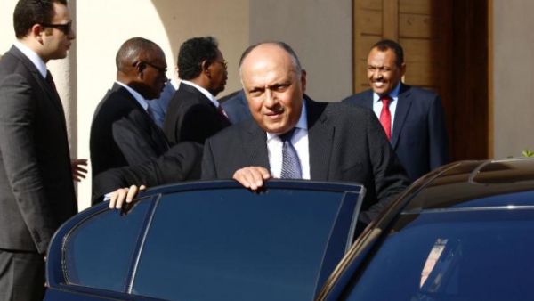 Egyptian Foreign Minister Sameh Shoukry gets in a car after meeting Sudan's President Omar al-Bashir in Khartoum on December 27, 2018. (AFP)