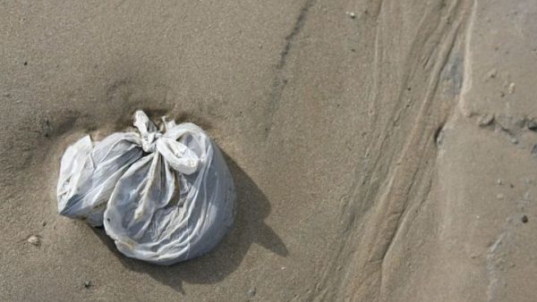  Villager in India eats sand from  plastic bags (AFP/File Photo)