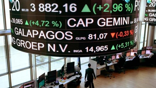 Share prices scroll across a screen hanging in a Paris stock exchange. (Eric Piermont/ AFP)