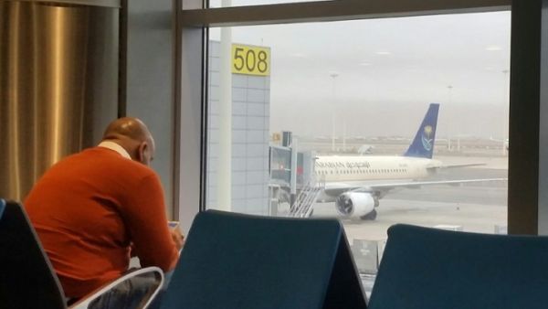 An expat waits for his flight at the King Khalid International airport on February 16, 2017. (Fayez Nureldine/ AFP)