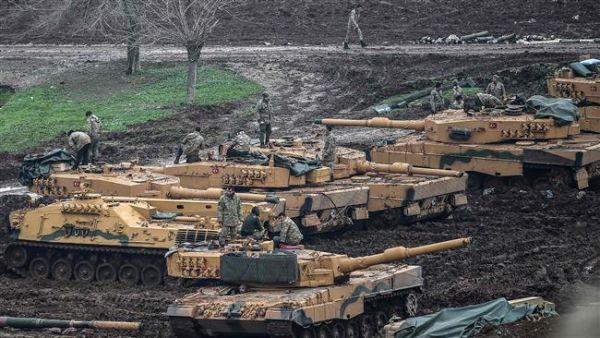 Turkish tanks are parked near the Syrian border at the Hassa district in Hatay province on Jan. 24, 2018, as part of the so-called Operation Olive Branch in Syria (AFP)