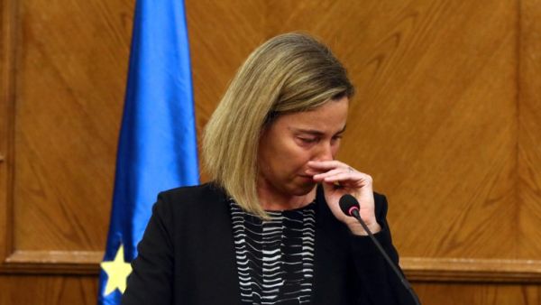 EU foreign policy chief Federica Mogherini reacts during a joint press conference with the Jordanian Foreign Minister in Amman, on March 22, 2016, upon receiving the news about a string of explosions that rocked Brussels airport and a city metro station. (AFP/Stringer)