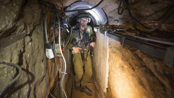 An Israeli soldier in one of the tunnels that the Israel Defense Force discovered. The Hamas spokesperson, Mushir al-Masri, vowed Hamas would dig more (Jack Guez/ AFP).