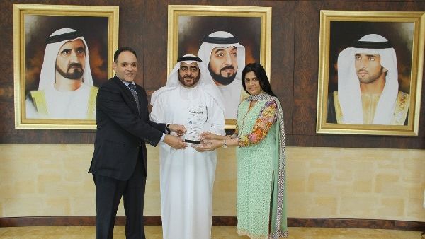 Dr. Mansoor Al Awar, Chancellor of HBMSU receiving the award from two of the university deans Dr. Mansoor Al Awar, Chancellor of HBMSU receiving the award from two of the university deans