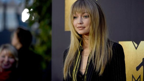 The 20-year-old says she wishes she could be on set with Zayn every day and that he is a natural model. (AFP/Frazer Harrison)