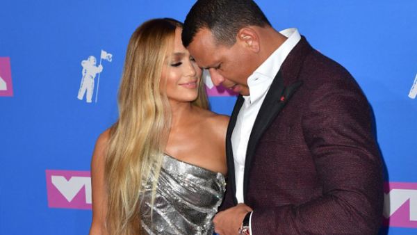 Jlo flaunted her fabulous figure in a plunging blue (Source: ANGELA WEISS / AFP ) 