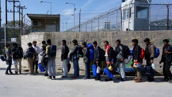 Migrants from Pakistan wait to enter Moria camp for migrants and refugees on the Greek island of Lesbos on March 21, 2016. (AFP/Stringer)