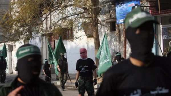 Palestinian Hamas militants rally in the streets of the Bureij refugee camp in central Gaza Strip on Dec. 25, 2009. (AFP/Mohammed Abed)