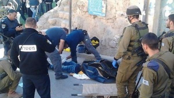 Israeli police are seen at a previous stabbing incident in Hebron. (AFP/File)