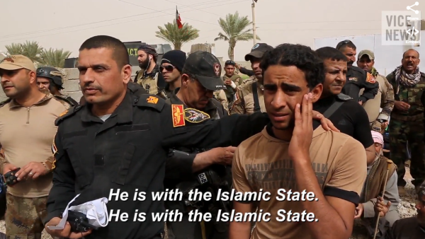 Major Salam of Iraq's Golden Division asks Sunni villagers if a certain youth is a Daesh member or not. (credit: VICE) 