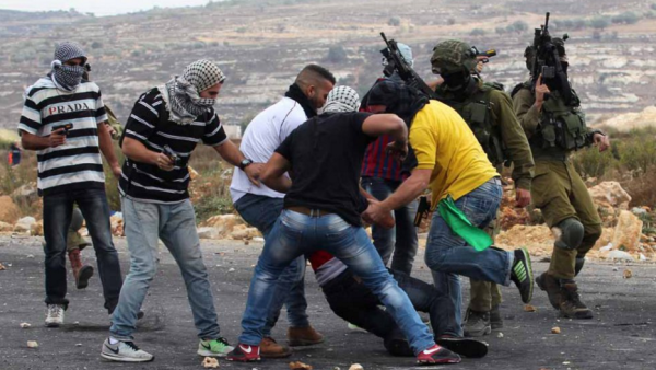 Undercover Israeli forces detain a Palestinian stone thrower near Ramallah in early October. (AFP/File) Undercover Israeli forces detain a Palestinian stone thrower near Ramallah in early October. (AFP/File)