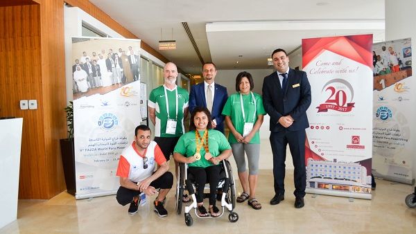 Yasser Moussa, Executive Assistant Manager, along with the Gold winner at the 9th Fazza Para Powerlifting Games 2018 and her coach.