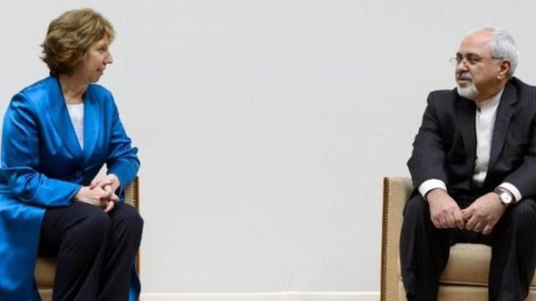 European Union foreign policy chief Catherine Ashton (L) talks to Iranian Foreign Minister Mohammad Javad Zarif before the start of two days of closed-door nuclear talks at the United Nations offices in Geneva. [arneruhnau]