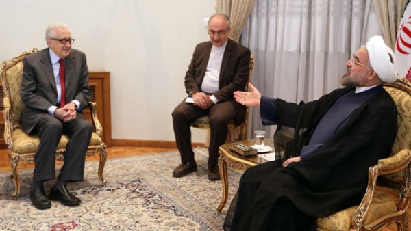 Iranian President Hassan Rouhani (R) meets with International Peace envoy to Syria Lakhdar Brahimi (L) in Tehran on October 27, 2013.(Image credit: AFP)