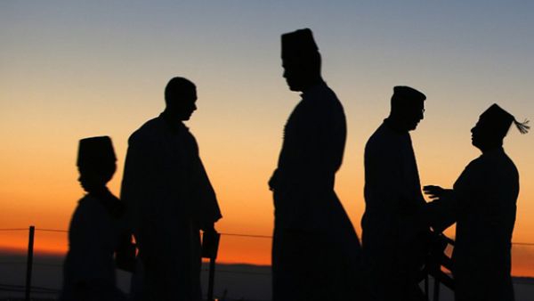The sun rises as Samaritan worshipers gather to pray on top of Mount Gerizim, near the northern West Bank city of Nablus, to celebrate the Shavuot festival. (AFP/File)