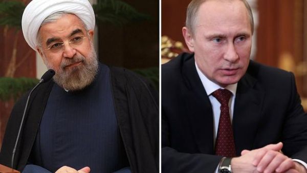 This combination of two recent pictures made on January 9, 2014 shows (at L) Iranian president Hassan Rouhani in Tehran in a picture released by the Iranian Presidency and Russian President Vladimir Putin in Moscow. [AFP]