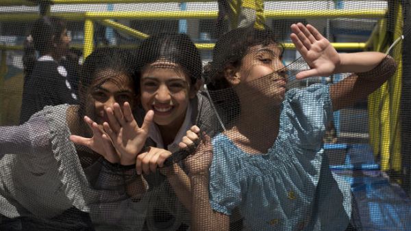 Palestinian girls from UNRWA schools play at a summer camp organised by UNRWA in Gaza City on June 17, 2013. (AFP/MOHAMMED ABED)