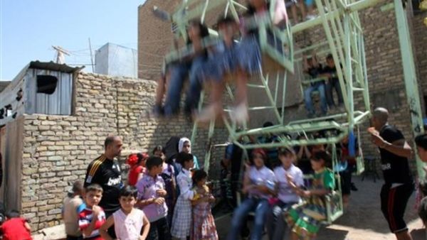 اطفال عراقيون يحتفلون خلال عيد الفطر/أ.ف.ب