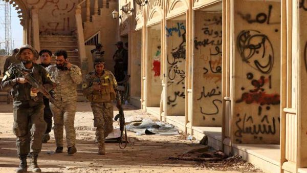 كنيسة عراقية مكتوب على جدرانها عبارات خطها عناصر تنظيم الدولة الاسلامية "داعش"