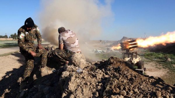 Fighters from the pro-government Popular Mobilization units set off a rocket launcher outside of Kirkuk, as they try to recapture the village of al-Bashir from Daesh on February 16, 2016. (AFP/Mohammed Sawaf)