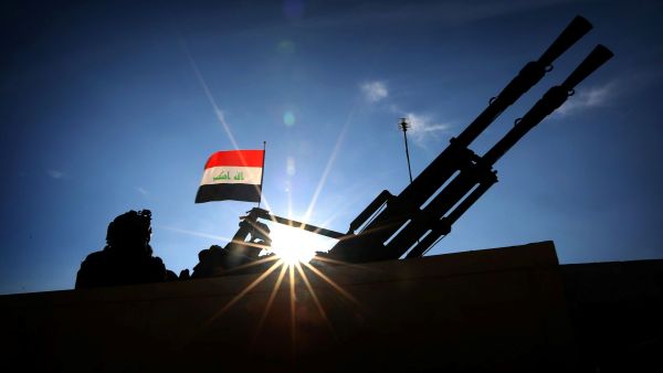 Iraqi troops stand guard in Makhmur, outside of Mosul, on February 11, 2016.  (AFP/Safid Hamed)