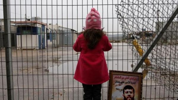A Palestinian girl stands outside an Israeli jail. (AFP/File Photo)