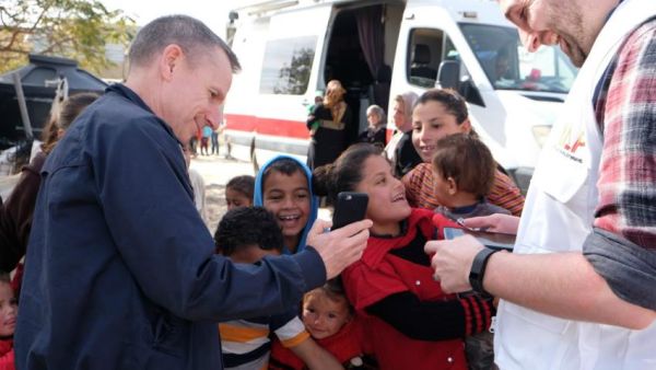 Hardy plays with Palestinian children during a January trip to the West Bank. (MAP)