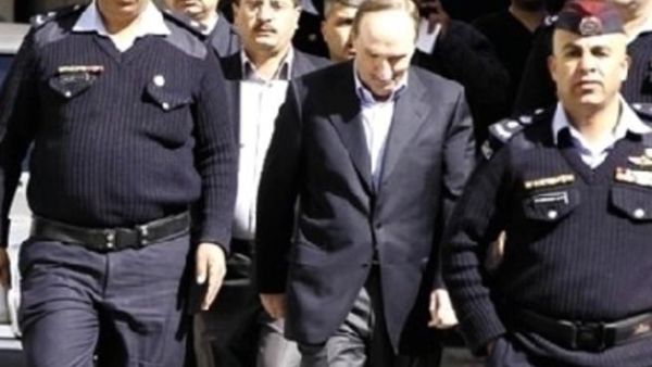 الذهبي برفقة رجال الامن خلال المحاكمة/أرشيف