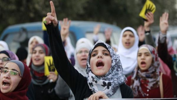 Jordanian women shout slogans as they protest in Amman on January 25, 2014. (AFP/Khalil Mazraawi) Jordanian women shout slogans as they protest in Amman on January 25, 2014. (AFP/Khalil Mazraawi)