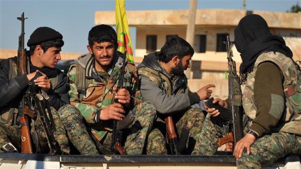 YPG fighters take a break from fighting in northeastern Syria (AFP/File)